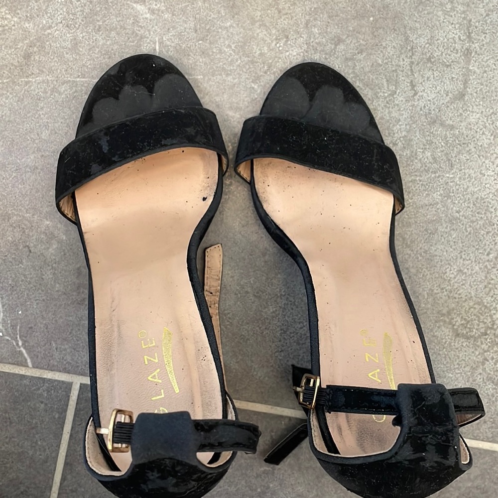 Very used black suede heels